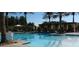 Inviting community pool with ample seating and shade structures, perfect for relaxation at 10248 Maggira Pl, Las Vegas, NV 89135
