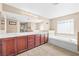 Bright main bathroom features a soaking tub, double sinks, and generous counter space at 1141 Brent Park Ct, Henderson, NV 89002
