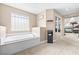 Bright bathroom boasts a large soaking tub, neutral colors, and seamless access to ensuite bedroom at 1141 Brent Park Ct, Henderson, NV 89002