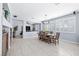 Dining area showcases a large table, tiled floors, and lots of natural light at 1141 Brent Park Ct, Henderson, NV 89002