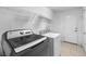 Clean laundry room with a modern washer and dryer set, and shelving for storage at 1141 Brent Park Ct, Henderson, NV 89002