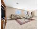 Upstairs living room with plush seating, a built-in entertainment center, and a cozy rug for relaxation at 1141 Brent Park Ct, Henderson, NV 89002