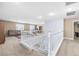 Upstairs loft area offers a versatile living space with staircase and comfortable furnishings at 1141 Brent Park Ct, Henderson, NV 89002