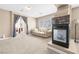 Bright main bedroom features an aquarium fireplace, neutral colors, and seamless access to ensuite bathroom at 1141 Brent Park Ct, Henderson, NV 89002