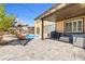 Charming patio with a built-in spa, ample seating, and a covered area for outdoor enjoyment at 1141 Brent Park Ct, Henderson, NV 89002