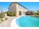 Backyard pool view showcases refreshing water, covered patio, and outdoor leisure space at 1141 Brent Park Ct, Henderson, NV 89002