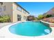 Gorgeous backyard oasis features a sparkling pool and mature landscaping for serene outdoor living at 1141 Brent Park Ct, Henderson, NV 89002