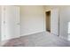 This bedroom features neutral carpet and walls, with a large closet that has sliding doors at 11840 Pelican Butte Ave, Las Vegas, NV 89138