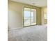 Bright bedroom featuring neutral walls, plush carpeting and an adjacent bathroom at 11840 Pelican Butte Ave, Las Vegas, NV 89138