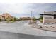 Cascades community entrance featuring manicured landscaping and contemporary signage against a cloudy sky backdrop at 11840 Pelican Butte Ave, Las Vegas, NV 89138
