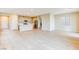 Spacious living room features an open floor plan, tile floors, and natural light at 11840 Pelican Butte Ave, Las Vegas, NV 89138