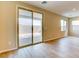 Bright living room with sliding glass door to the backyard patio at 11840 Pelican Butte Ave, Las Vegas, NV 89138