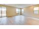 Living room with large windows and sliding door to the backyard at 11840 Pelican Butte Ave, Las Vegas, NV 89138