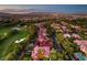 Stunning areal view of a vibrant community with golf course and residential living against a mountain backdrop at 11926 Port Labelle Dr, Las Vegas, NV 89141