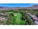 A scenic aerial view highlighting the golf course and residential community nestled amidst desert landscape at 11926 Port Labelle Dr, Las Vegas, NV 89141