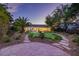 Expansive backyard with a pool, putting green, and beautifully landscaped grounds at 11926 Port Labelle Dr, Las Vegas, NV 89141