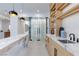 Stylish bar area features custom lighting, open shelving, modern finishes, marble counters, and a wine cellar at 11926 Port Labelle Dr, Las Vegas, NV 89141