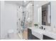 Modern bathroom featuring marble, a glass shower, and updated fixtures at 11926 Port Labelle Dr, Las Vegas, NV 89141