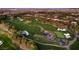 Aerial view showcasing a meticulously designed golf course with lush greens and intricate water features at 11926 Port Labelle Dr, Las Vegas, NV 89141