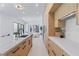 Modern kitchen with an island, marble countertops, custom wood cabinets and tile backsplash at 11926 Port Labelle Dr, Las Vegas, NV 89141