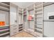 A luxurious walk-in closet featuring custom shelving and drawer storage at 11926 Port Labelle Dr, Las Vegas, NV 89141