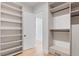 A well-organized walk-in closet featuring custom shelving and ample storage space at 11926 Port Labelle Dr, Las Vegas, NV 89141