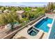 Inviting backyard oasis with a private pool and hot tub, perfect for relaxation and outdoor enjoyment at 1339 Echo Creek St, Henderson, NV 89052