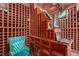 Exquisite wine cellar features custom wood storage, a computer station, and comfortable seating for tasting at 1339 Echo Creek St, Henderson, NV 89052