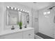 Modern bathroom boasts dual sinks, sleek black fixtures, and a stylish, tiled shower space at 1608 E Mcdonald Ave, North Las Vegas, NV 89030