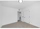 Bright bedroom featuring neutral carpet and white walls providing a clean and modern aesthetic at 1608 E Mcdonald Ave, North Las Vegas, NV 89030