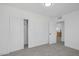 Simple bedroom featuring fresh carpet, new paint, and an updated closet system at 1608 E Mcdonald Ave, North Las Vegas, NV 89030