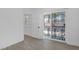 Bright bedroom featuring a sliding glass door and tiled floor at 1608 E Mcdonald Ave, North Las Vegas, NV 89030