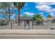 Charming single-story home with secure fencing, mature trees, and a well-maintained front yard at 1608 E Mcdonald Ave, North Las Vegas, NV 89030
