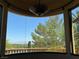 Balcony view of lush greenery and distant mountains under a clear sky at 1800 Amarone Way, Henderson, NV 89012
