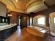 Lavish bathroom features dual vanities, a soaking tub with jets, walk-in shower and elegant lighting at 1800 Amarone Way, Henderson, NV 89012