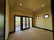 Bedroom with french doors to balcony, neutral carpet and recessed lighting at 1800 Amarone Way, Henderson, NV 89012