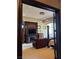 The luxurious main bedroom boasts dark wood trim and a fireplace at 1800 Amarone Way, Henderson, NV 89012