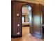 Arched doorway provides a glimpse of a well-appointed bedroom at 1800 Amarone Way, Henderson, NV 89012