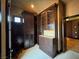 Spacious walk-in closet with custom built-ins for organization and displaying wardrobe at 1800 Amarone Way, Henderson, NV 89012