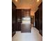 Spacious walk-in closet with custom built-in shelving and drawer organization at 1800 Amarone Way, Henderson, NV 89012