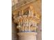 Close-up of a decorative stone column capital featuring intricate floral carvings at 1800 Amarone Way, Henderson, NV 89012