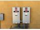 Two Generac electrical transfer switches installed outside a house at 1800 Amarone Way, Henderson, NV 89012