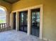 The home has decorative columns with large windows and door, framing the outdoor space at 1800 Amarone Way, Henderson, NV 89012
