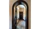 Arched doorway leads to a bathroom with tiled shower and soaking tub at 1800 Amarone Way, Henderson, NV 89012