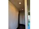 The foyer hallway has dark wood flooring and soft lighting at 1800 Amarone Way, Henderson, NV 89012