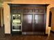 Built-in refrigerator, oven, and coffee maker in a custom cabinet to create a seamless look at 1800 Amarone Way, Henderson, NV 89012