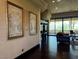 A luxurious living room with dark wood floors and balcony access at 1800 Amarone Way, Henderson, NV 89012