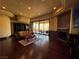 A spacious living room with fireplace and outside balcony at 1800 Amarone Way, Henderson, NV 89012