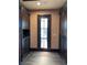 The spacious mudroom features ample storage, a door to the exterior, and neutral color palette at 1800 Amarone Way, Henderson, NV 89012