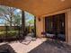 Charming patio features a wrought iron gate, outdoor seating, and access to lush landscaping at 1800 Amarone Way, Henderson, NV 89012